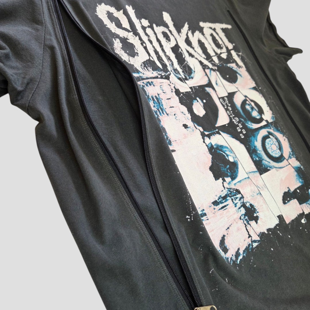 An Upcycled Breastfeeding (Nursing) & Pumping Slipknot Eyeless Band t-shirt L (100590) by Amplified, designed for both style and practicality, sits beneath a partially unzipped black jacket. This affordable nursing wear features a striking graphic of abstract shapes and distressed white text—making it the perfect choice for Slipknot fans seeking breastfeeding clothing that doesn’t compromise on edge or comfort.
