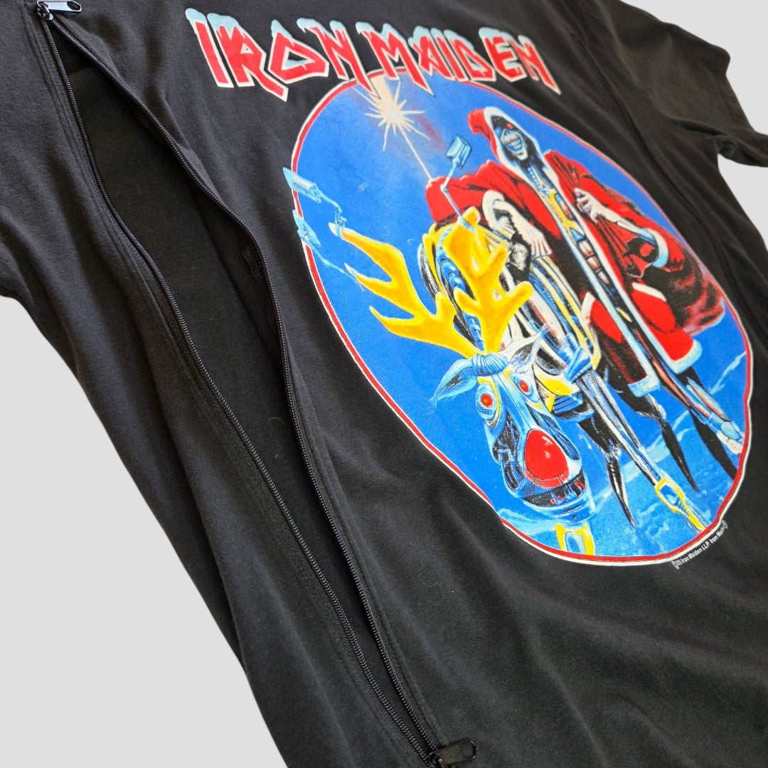 The George Upcycled Breastfeeding (Nursing) & Pumping Black Iron Maiden Christmas Band t-shirt (size L, 100594) is a black tee featuring a vibrant graphic and two vertical zippers along the sides for convenient breastfeeding or pumping access. The shirt is displayed laid flat on a light background.