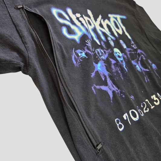 An upcycled Slipknot nursing and pumping t-shirt (size M) features a black base with a blue-tinted band image, white logo, numbers at the bottom, and a diagonal front zipper—offering affordable nursing wear with an edgy twist.