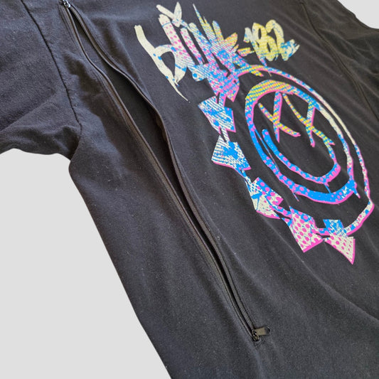 An upcycled black Blink-182 band t-shirt in size XXL, featuring a colorful smiley face design and a discreet vertical zipper for nursing and pumping convenience—crafted from 100% cotton, perfect as stylish and functional breastfeeding clothing.