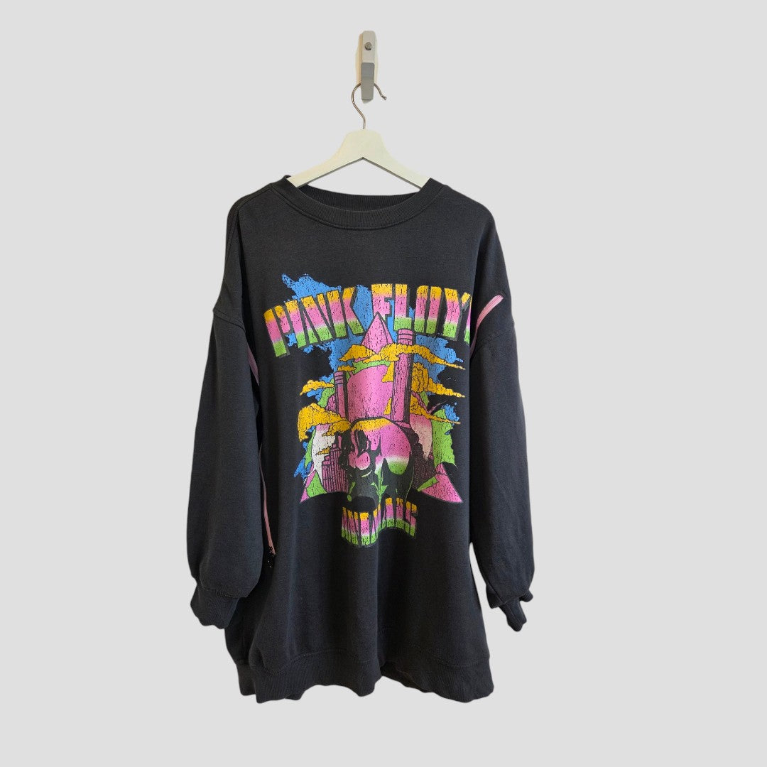 Upcycled H&M Breastfeeding (Nursing) & Pumping Grey Pink Floyd Band sweatshirt dress in size L (100548), featuring a bold, retro-style graphic with vibrant colors and stylized text. Made from eco-friendly materials, this unique dress hangs on a white hanger against a plain light gray background.