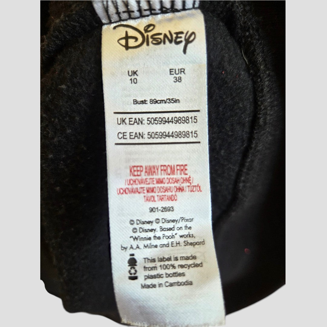 A Disney Upcycled Breastfeeding (Nursing) & Pumping Black Glitter Bow Christmas sweatshirt (UK 10/EUR 38, bust 89 cm) proudly bears a fire safety warning and is crafted in Cambodia from recycled plastic bottles. Perfect for Winnie the Pooh fans, this sustainable Disney piece blends comfort with eco-friendly style for everyday wear.