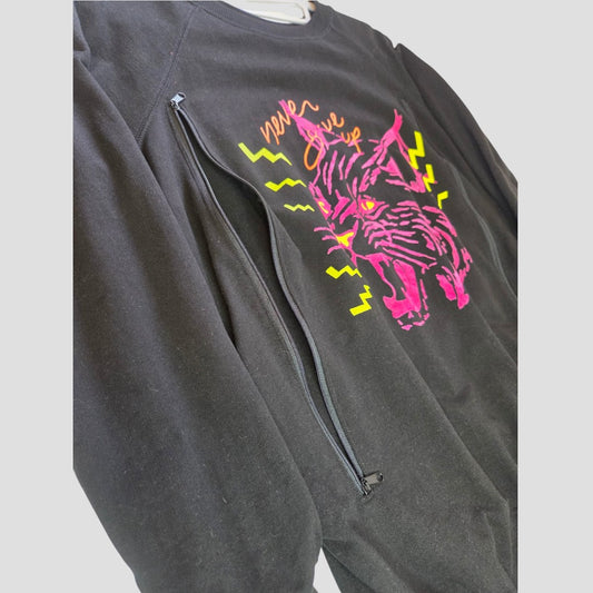 The Nine+ Quarter Upcycled Breastfeeding (Nursing) & Pumping Black Tiger Maternity Sweatshirt (size M, 100648) features a bold pink and yellow roaring big cat graphic with lightning bolts and a vertical side zipper on the chest for easy nursing or pumping access—perfect as an organic cotton, stylish maternity and breastfeeding top.
