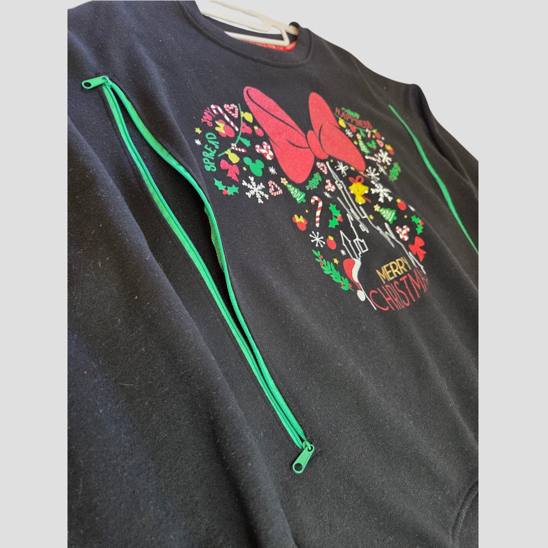 Disney Upcycled Breastfeeding (Nursing) & Pumping Black Christmas sweatshirt UK10 (100640): This thoughtfully designed black Disney sweatshirt features practical green zippers on both sides for easy nursing or pumping access. The festive center design showcases a large glittery red bow, sparkling snowflakes, and the text “Merry Christmas,” surrounded by holiday-themed graphics. Blending seasonal cheer with discreet breastfeeding convenience, this unique upcycled piece is perfect for the holidays.