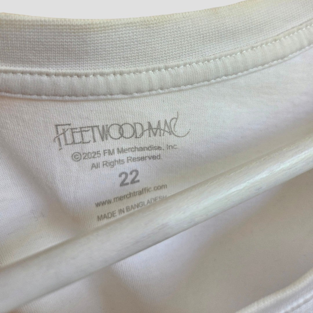 The collar of a white 100% cotton Upcycled Breastfeeding (Nursing) & Pumping Cream Floral Fleetwood Mac Band t-shirt UK22 (100641) featuring a printed Fleetwood Mac logo, copyright information, and the size 22.